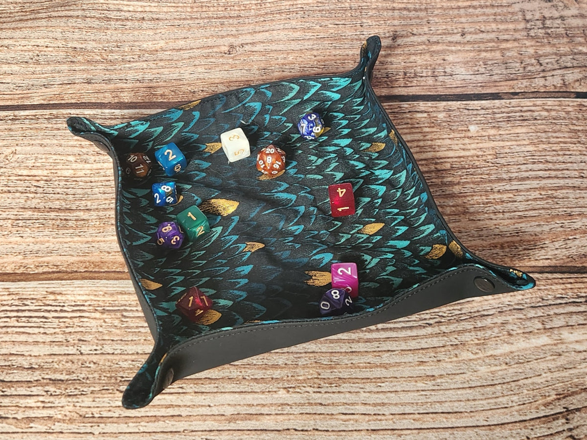 Handmade dragon-scale dice tray holding assorted polyhedral dice to demonstrate use; dice are shown for scale and are not included.
